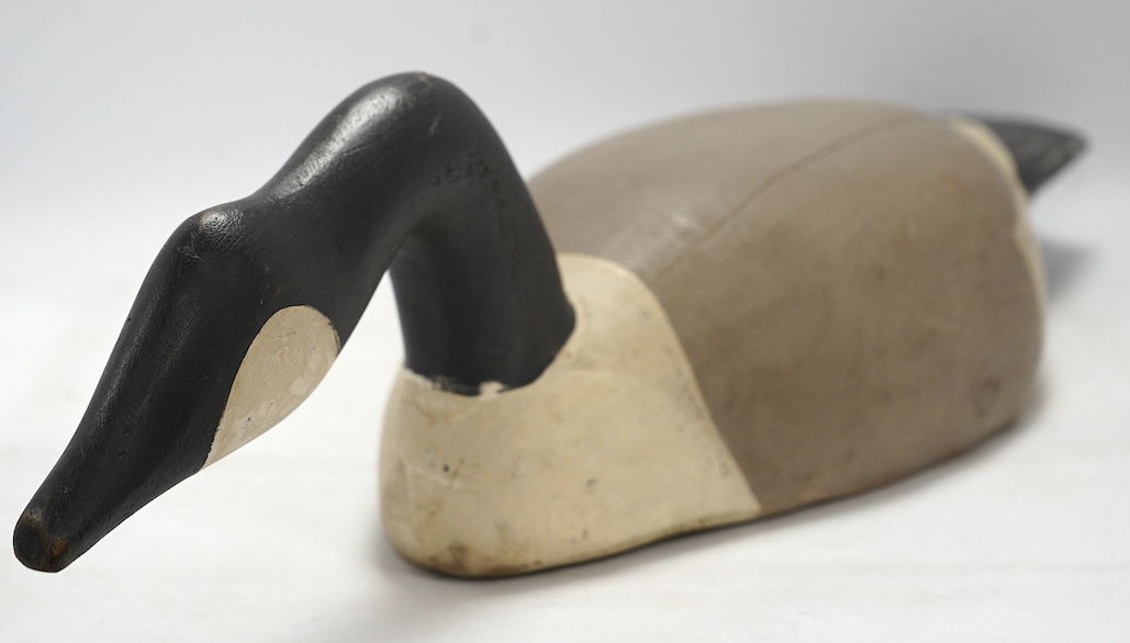 A vintage carved and painted wood decoy goose, 80cm in length. Condition - fair